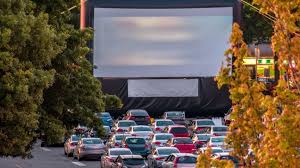 Cars parked in a drive-in movie lot